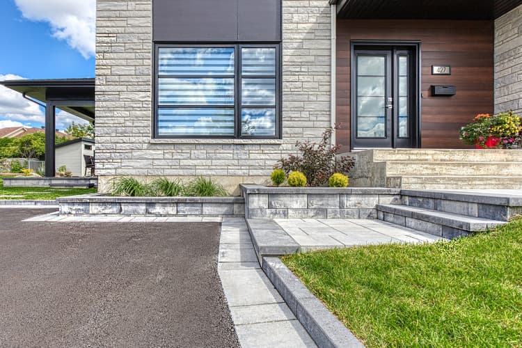 Residential paver driveway and landscaping by Terrassement XP